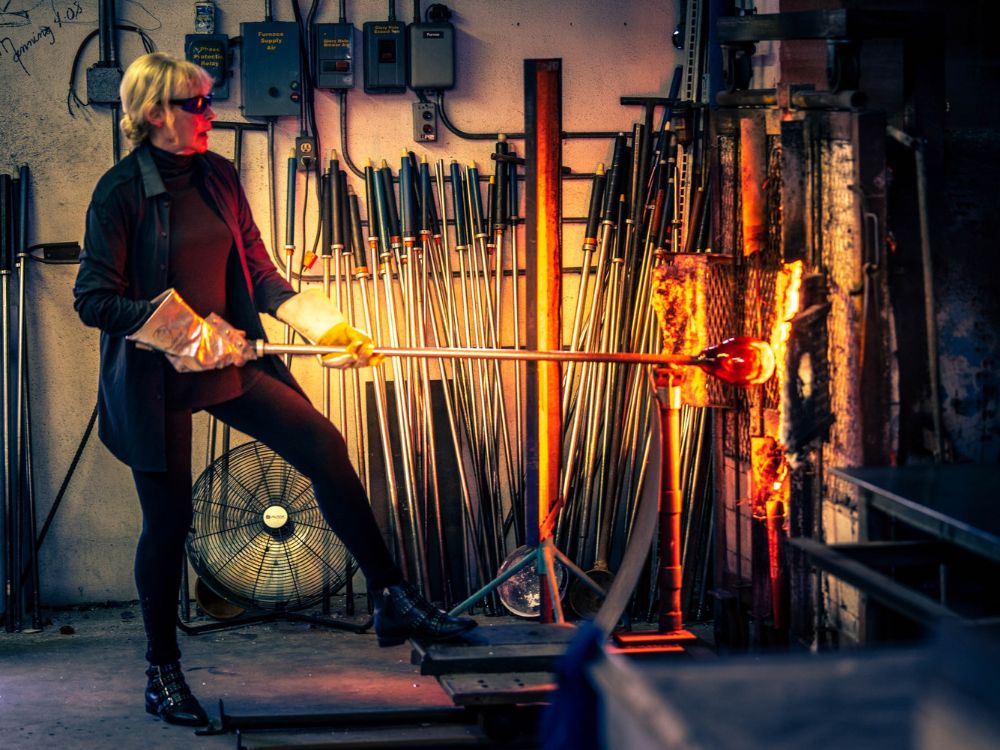 Trish Duggan glass blowing in studio creating contemporary glass art